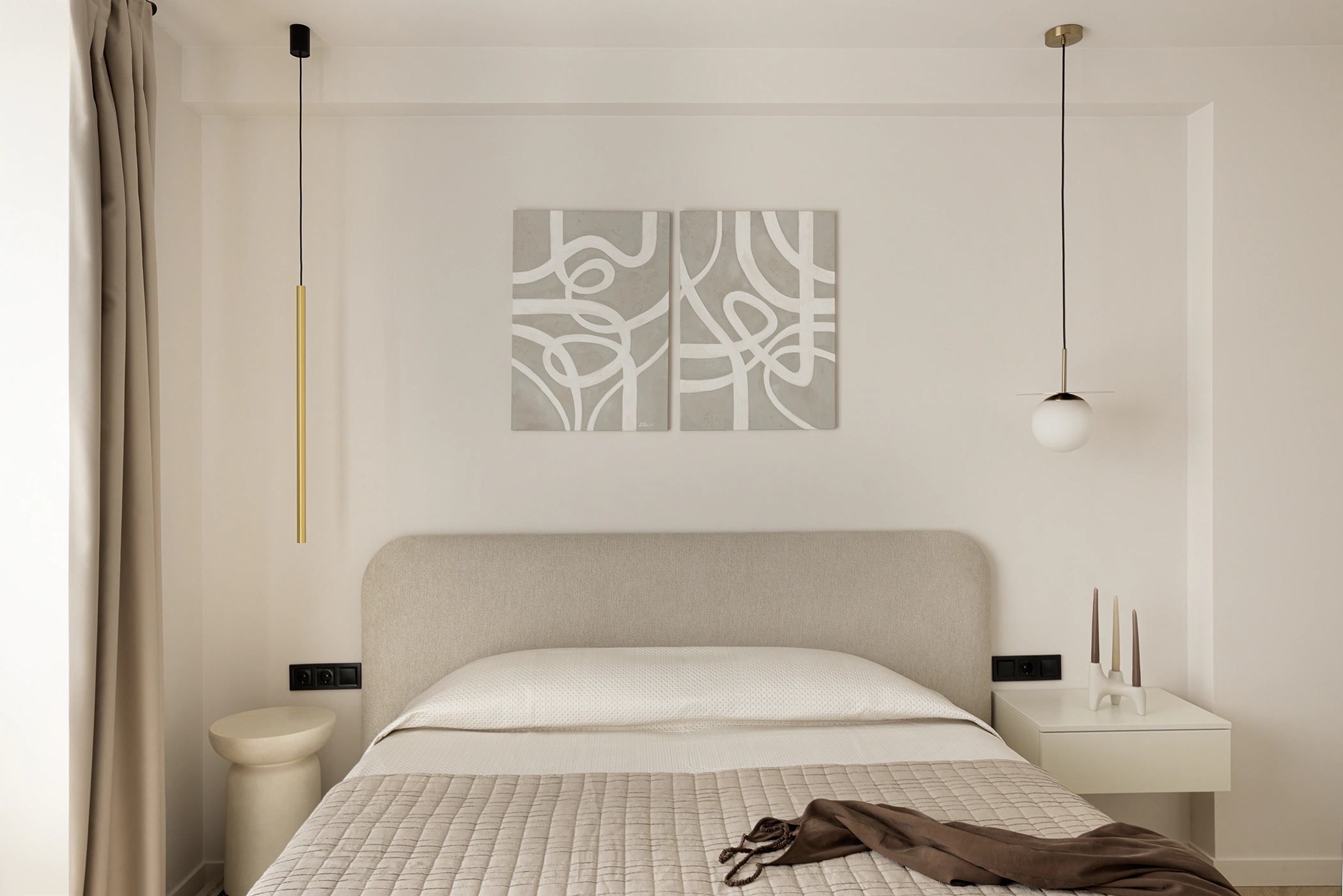 Bedroom—upholstered headboard and quilted cover, asymmetrical pendant lights, abstract diptych above, small side tables
