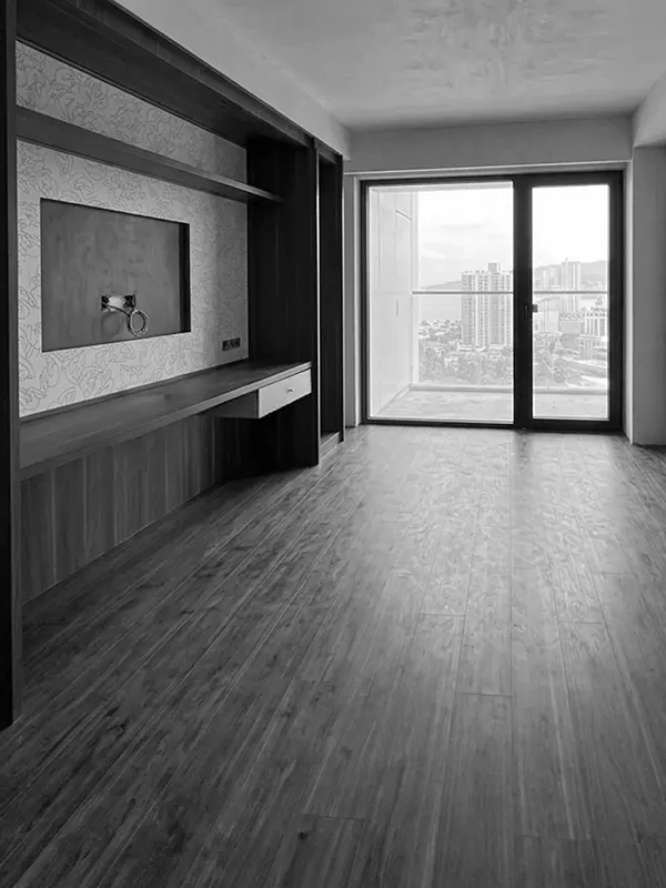 Finished studio apartment in Marriott residence in Batumi with custom wall unit, wood-look flooring and balcony view